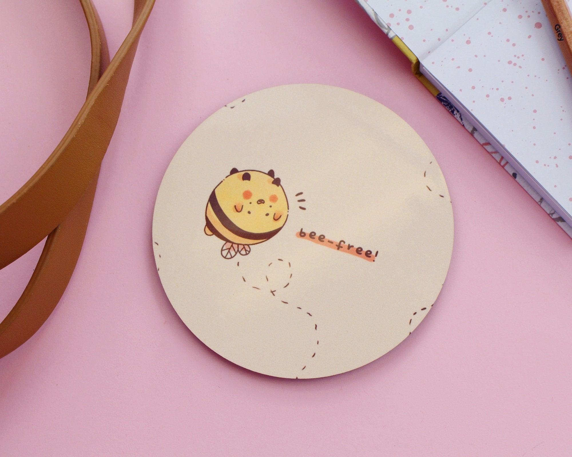 Adorable handprinted MDF coasters featuring original bumblebee illustrations, perfect for adding kawaii buzz to your space.