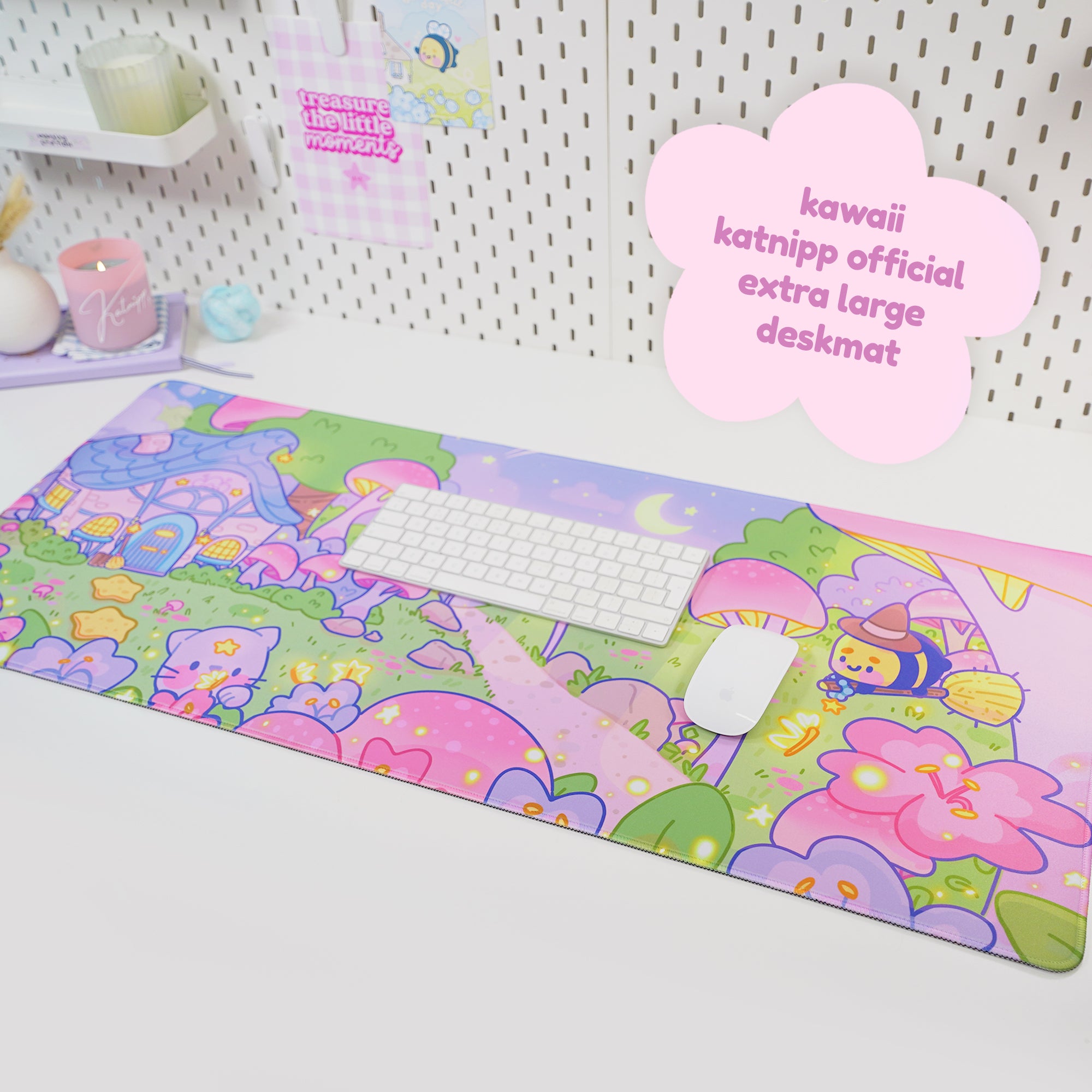 A colorful gaming desk mat with a Pastel Witch and Bumblebutt theme, featuring a broomstick riding bumblebutt, a cozy cottage, and a vibrant autumn forest scene.
