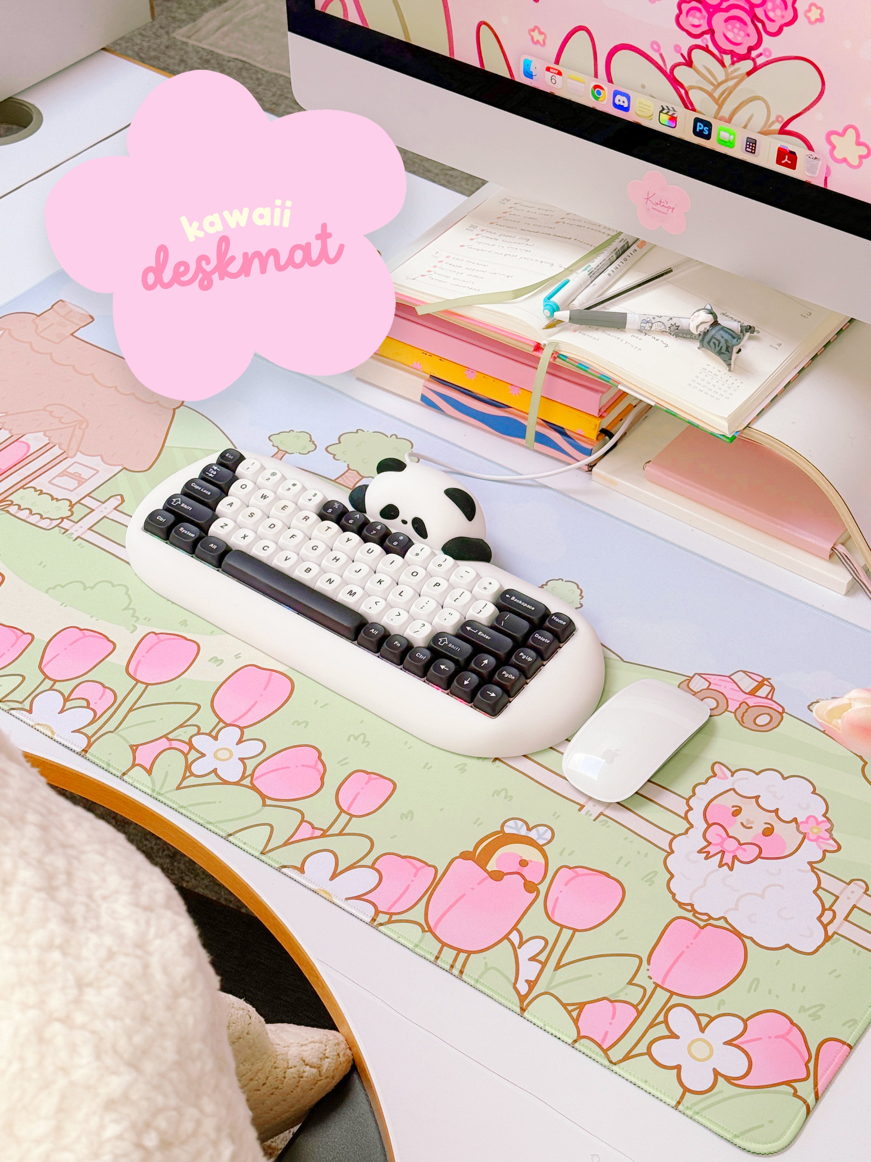 A gaming desk mat with a whimsical spring design, featuring cartoon sheep, tulips, and a cottage, in a large size covering most of the desk.