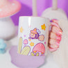 White Glossy Durham mug featuring Bumblebutt the bumble bee in a magical plant scene