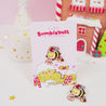 Official Bumblebutt Christmas Candy Cane Academy Enamel Pin - Festive holiday-themed enamel pin featuring Bumblebutt the bee holding a candy cane.