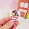Official Bumblebutt Christmas Candy Cane Academy Enamel Pin - Festive holiday-themed enamel pin featuring Bumblebutt the bee holding a candy cane. 3