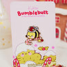 Official Bumblebutt Christmas Candy Cane Academy Enamel Pin - Festive holiday-themed enamel pin featuring Bumblebutt the bee holding a candy cane. 7