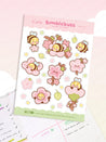 Image of Bumblebutt Sakura planner sticker sheet featuring cute bumblebee surrounded by pink cherry blossoms on vibrant A6 premium paper.