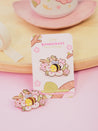 Enamel pin featuring Bumblebutt resting on a blossom branch, part of the Sakura Collection from Katnipp. 3