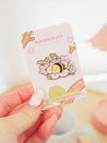 Enamel pin featuring Bumblebutt resting on a blossom branch, part of the Sakura Collection from Katnipp. 8