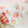 Adorable Bumblebutt Cherry Blossom Mug - Hand-printed white ceramic mug featuring a cute Bumblebutt design surrounded by cherry blossoms. 12