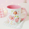 Adorable Bumblebutt Cherry Blossom Mug - Hand-printed white ceramic mug featuring a cute Bumblebutt design surrounded by cherry blossoms.
