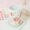 Adorable Bumblebutt Cherry Blossom Mug - Hand-printed white ceramic mug featuring a cute Bumblebutt design surrounded by cherry blossoms. 6