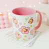 Adorable Bumblebutt Cherry Blossom Mug - Hand-printed white ceramic mug featuring a cute Bumblebutt design surrounded by cherry blossoms. 7