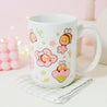 Adorable Bumblebutt Cherry Blossom Mug - Hand-printed white ceramic mug featuring a cute Bumblebutt design surrounded by cherry blossoms. 8