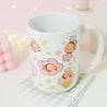 Adorable Bumblebutt Cherry Blossom Mug - Hand-printed white ceramic mug featuring a cute Bumblebutt design surrounded by cherry blossoms. 9