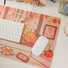 Cosy Autumn Gaming Desk Pad | Kawaii Fall Desk Mat | Pumpkin Café Scene for Cute Workspace Decor - Katnipp Studios