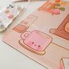 Cosy Autumn Gaming Desk Pad | Kawaii Fall Desk Mat | Pumpkin Café Scene for Cute Workspace Decor - Katnipp Studios