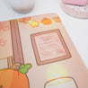 Cosy Autumn Gaming Desk Pad | Kawaii Fall Desk Mat | Pumpkin Café Scene for Cute Workspace Decor - Katnipp Studios