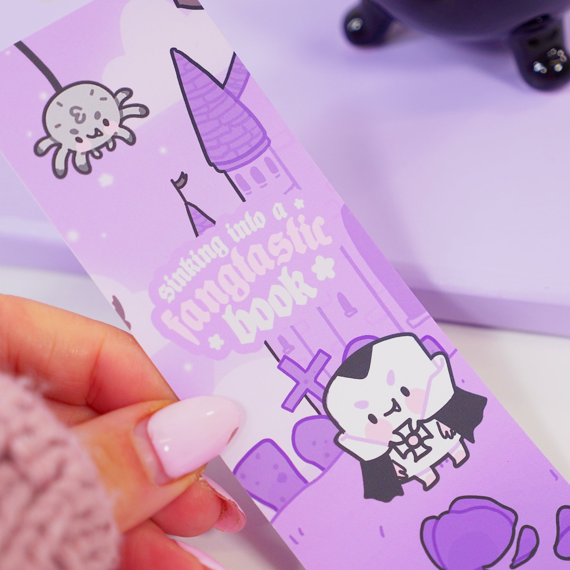 Kawaii Gothic Halloween Bookmark – ‘Sinking into a Fangtastic Book’ - Double-Sided Vinyl Stationery for Spooky Reading - Katnipp Studios